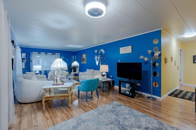 living room featuring wood finished floors and baseboards