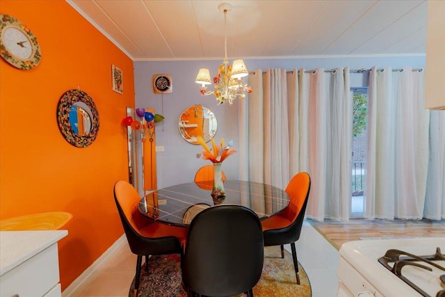 dining space with ornamental molding, light tile patterned flooring, and a notable chandelier