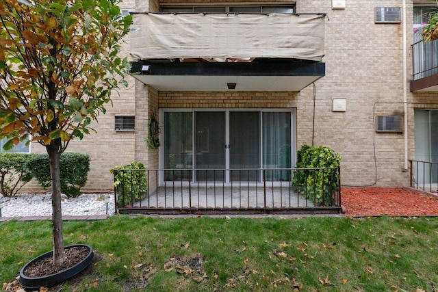 exterior space with a yard and brick siding