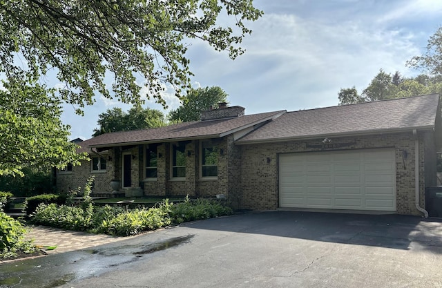26980 N Pierre Dr, Mundelein, IL 60060 - ranch-style house featuring brick siding, driveway, a garage, a chimney, and a shingled roof