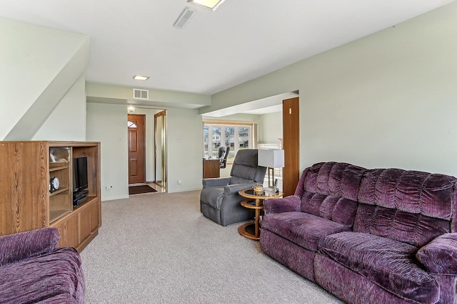 living area featuring carpet and visible vents