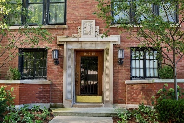 property entrance with brick siding