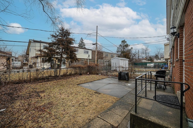 view of yard with a patio area and a fenced backyard