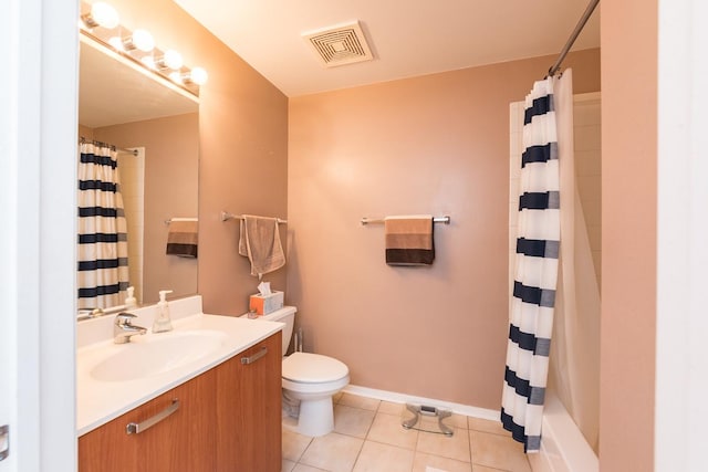 bathroom featuring visible vents, toilet, vanity, a shower with curtain, and tile patterned floors