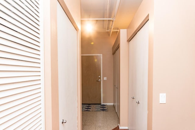 hallway featuring tile patterned floors