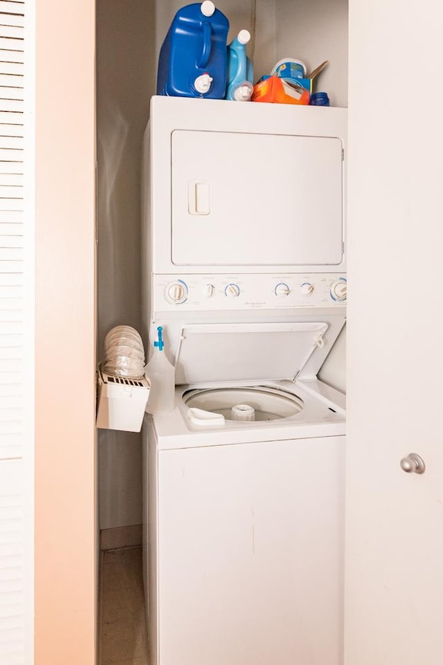 laundry area with laundry area and stacked washing maching and dryer