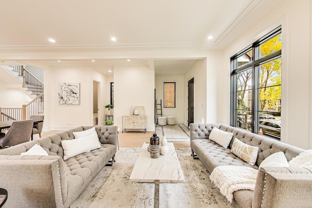 living room with light wood-type flooring, stairs, baseboards, and recessed lighting