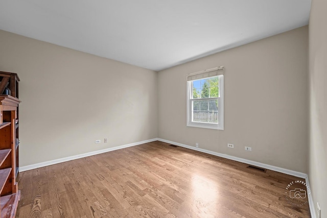 322 Arlington Ave, Naperville, IL 60565 - unfurnished room featuring wood finished floors and baseboards