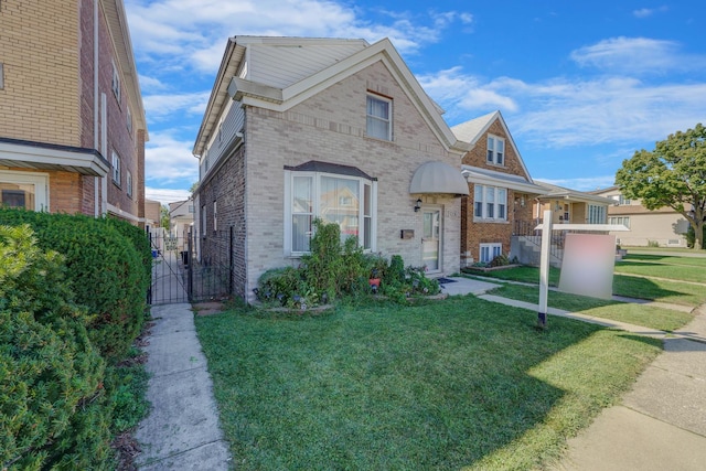 view of front facade featuring central AC unit, brick siding, fence, a gate, and a front lawn