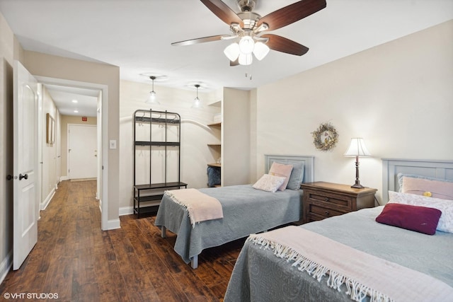 bedroom featuring dark wood-type flooring and baseboards