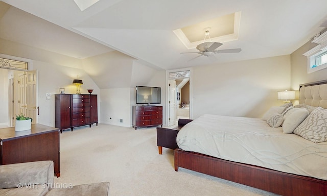 carpeted bedroom featuring lofted ceiling and a ceiling fan