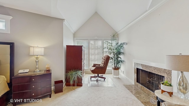 living area featuring high vaulted ceiling, a fireplace, carpet flooring, and baseboards