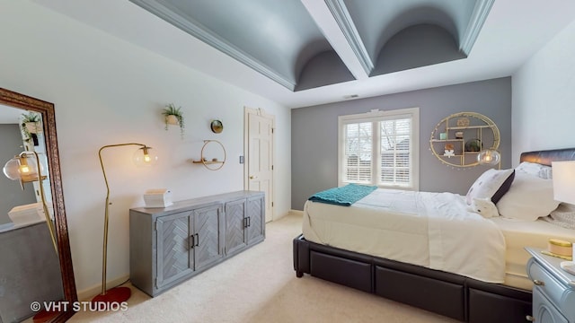 bedroom featuring light carpet, baseboards, a tray ceiling, and ornamental molding