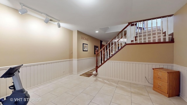 interior space with stairs, a wainscoted wall, recessed lighting, track lighting, and tile patterned floors