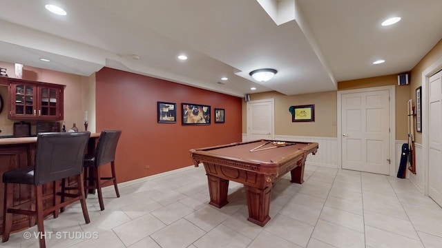 rec room featuring light tile patterned floors, billiards, wainscoting, a bar, and recessed lighting