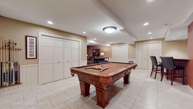 recreation room with a dry bar, light tile patterned floors, recessed lighting, pool table, and wainscoting