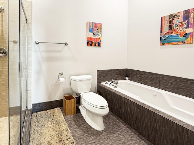 bathroom featuring a stall shower, tile patterned floors, toilet, and a bath