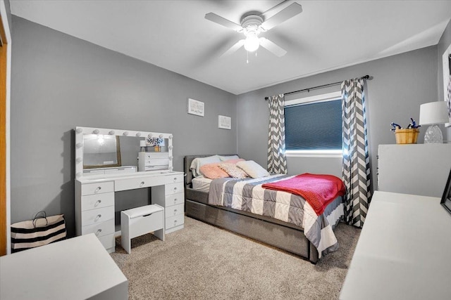 bedroom featuring a ceiling fan and light colored carpet