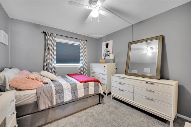 bedroom featuring a ceiling fan and light carpet