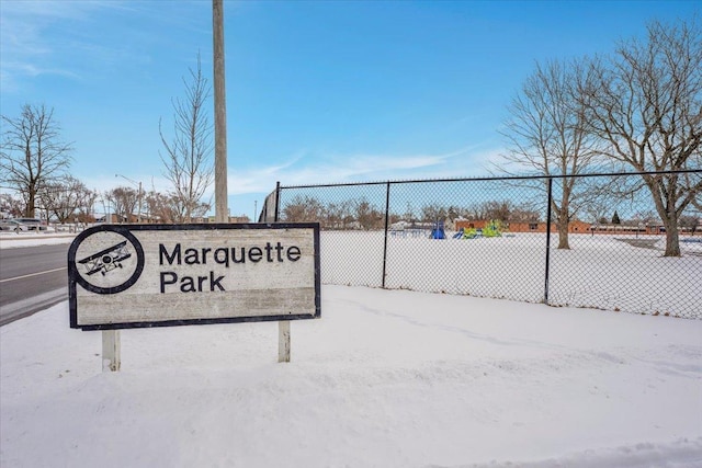 community sign featuring fence