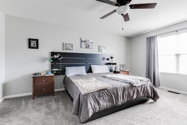 bedroom featuring carpet, visible vents, baseboards, and ceiling fan