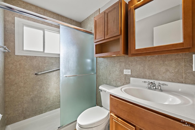 full bath featuring tile walls, toilet, decorative backsplash, a shower stall, and vanity