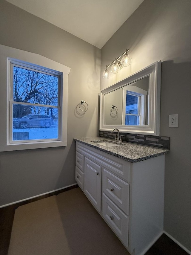 bathroom featuring vanity and baseboards