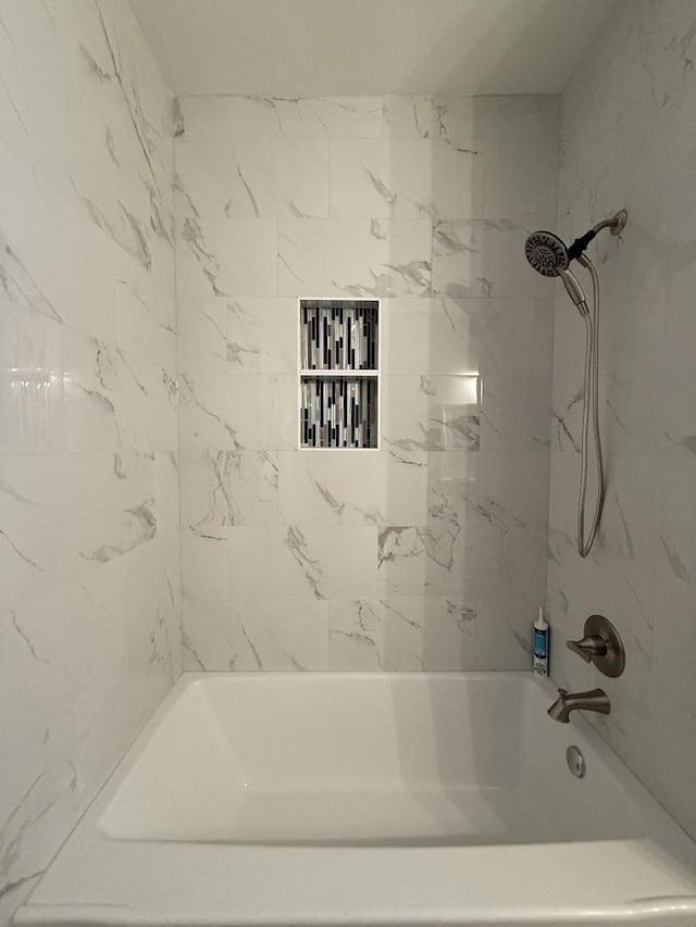 bathroom with shower / tub combination