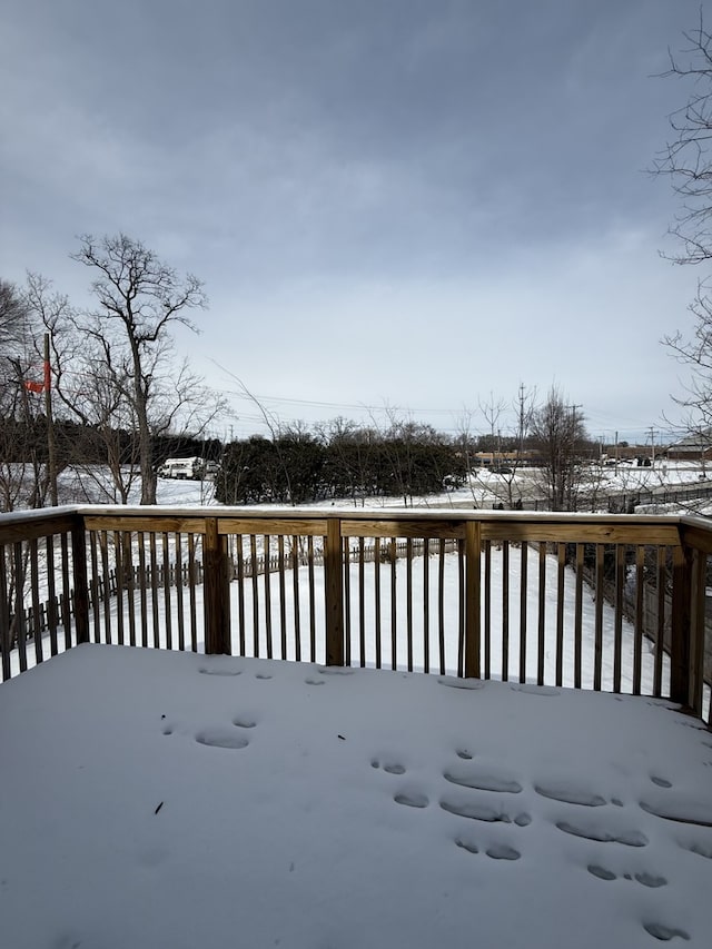 view of snow covered deck