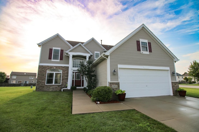 traditional-style house featuring an attached garage, stone siding, concrete driveway, and a front yard