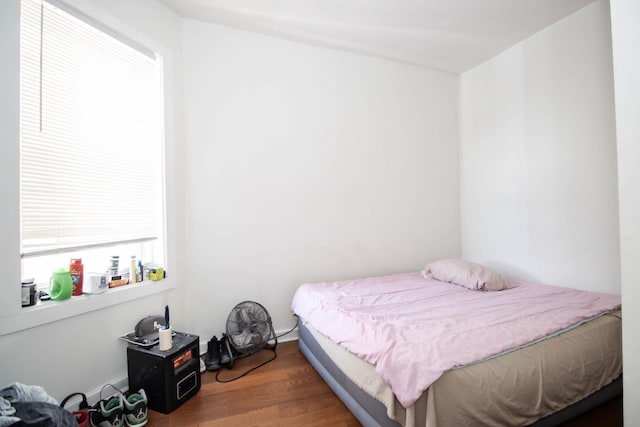 bedroom featuring dark wood-type flooring