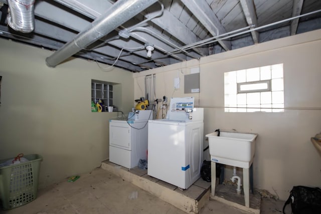 clothes washing area featuring washer and dryer and laundry area