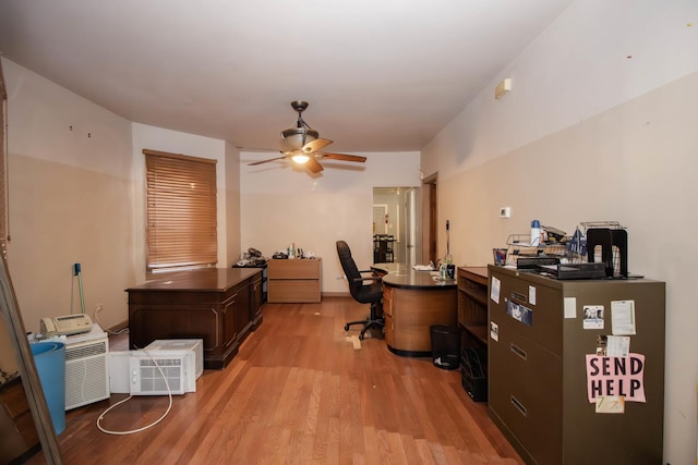 office with light wood-style flooring and a ceiling fan