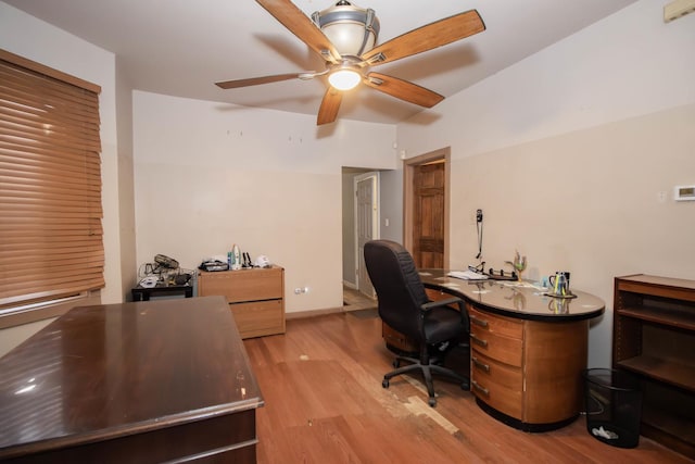 office space featuring light wood-style flooring, baseboards, and a ceiling fan