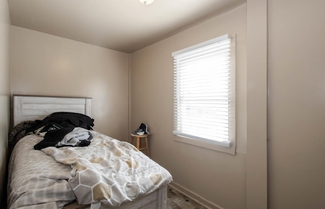 bedroom featuring baseboards