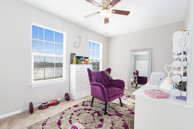 carpeted bedroom with ceiling fan, multiple windows, and baseboards