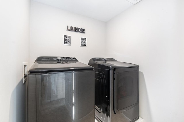 laundry area featuring laundry area and washer and clothes dryer