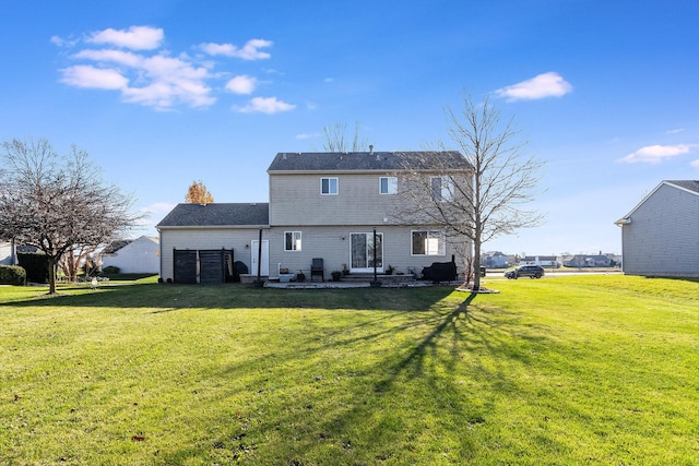 rear view of house with a lawn