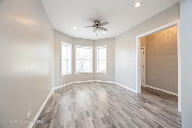 unfurnished room featuring light wood-type flooring, ceiling fan, baseboards, and recessed lighting