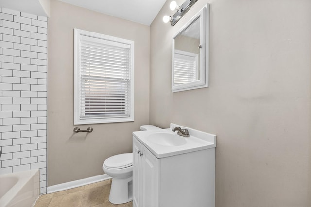 bathroom with baseboards, toilet, vanity, tile patterned flooring, and shower / bathtub combination