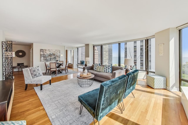 living room featuring expansive windows and wood finished floors