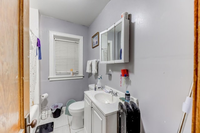 bathroom with toilet, vanity, and baseboards