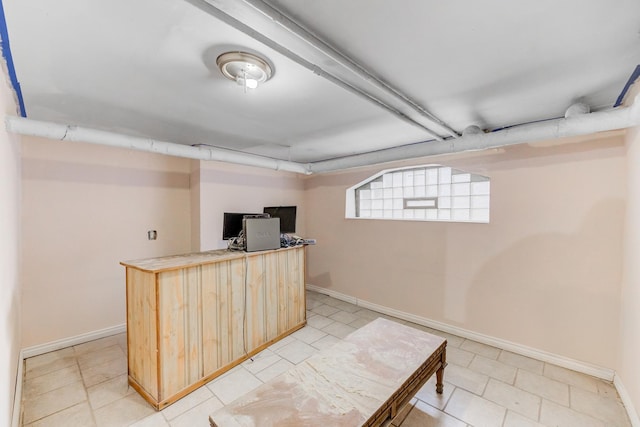 interior space with light brown cabinets and baseboards