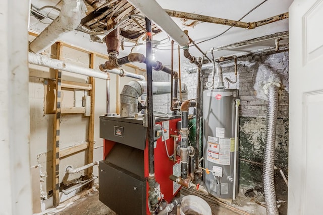 utility room featuring water heater and a heating unit