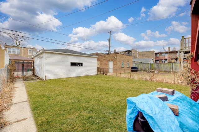 view of yard with an outdoor structure and fence