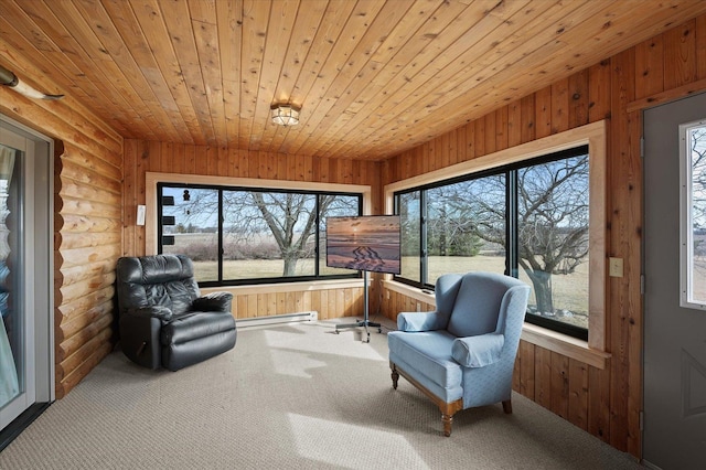 sunroom / solarium with a baseboard heating unit and wooden ceiling