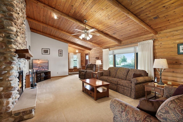 carpeted living area featuring lofted ceiling with beams, wooden ceiling, log walls, and a stone fireplace