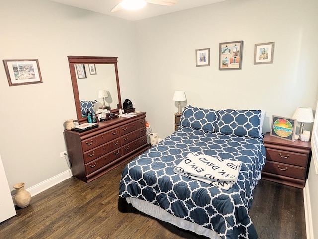 bedroom featuring ceiling fan, dark wood finished floors, and baseboards