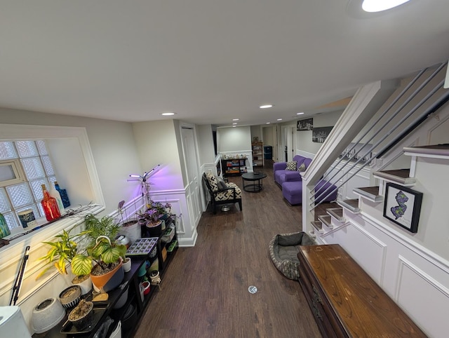 living room with stairs, wood finished floors, and recessed lighting