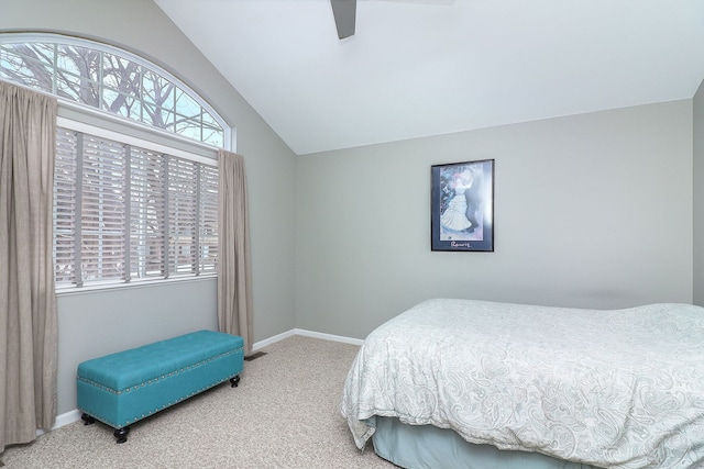 bedroom with vaulted ceiling, carpet floors, ceiling fan, and baseboards